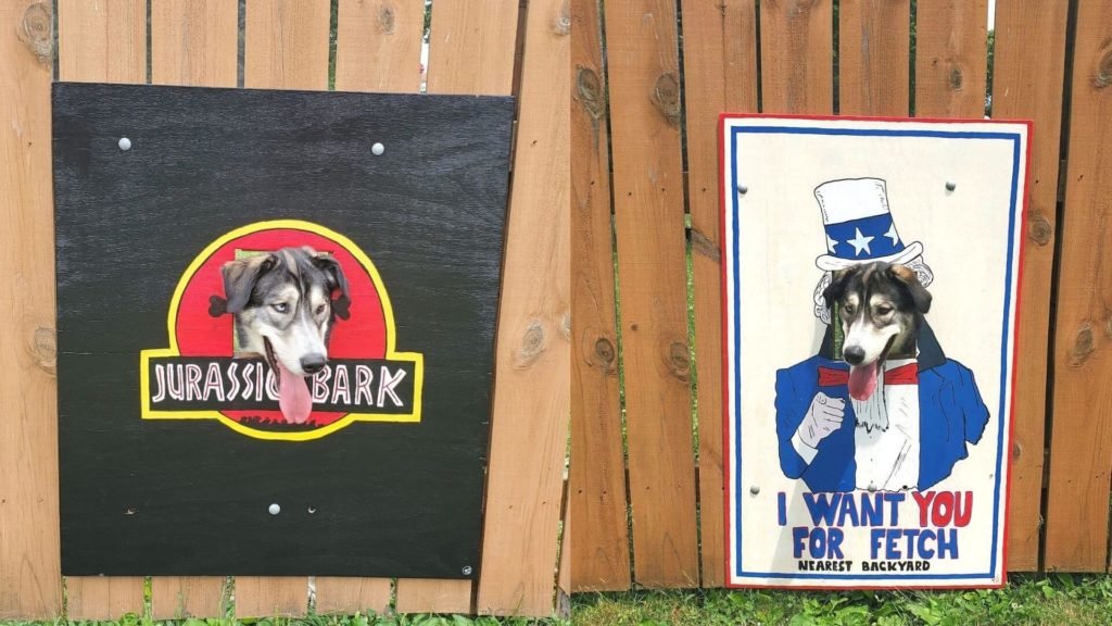 Stanley & his son decided to decorate the hole on their fence for their curious dog with some famous paintings & movie posters. (1)