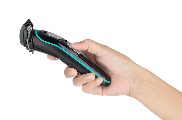 hand-holding-wireless-trimmer-of-dogs